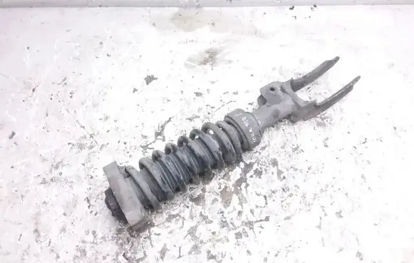 Volkswagen Touareg I Front shock absorber with coil spring 7L6412022N