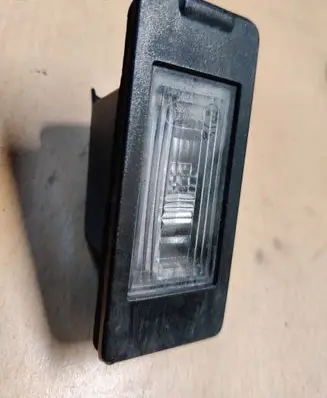 Chevrolet Malibu Number plate light 13590043