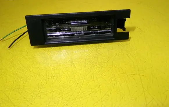 Opel Corsa D Number plate light 13139990