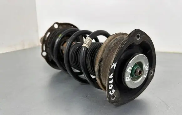 Volkswagen Golf VII Front shock absorber with coil spring 5Q0413023FK