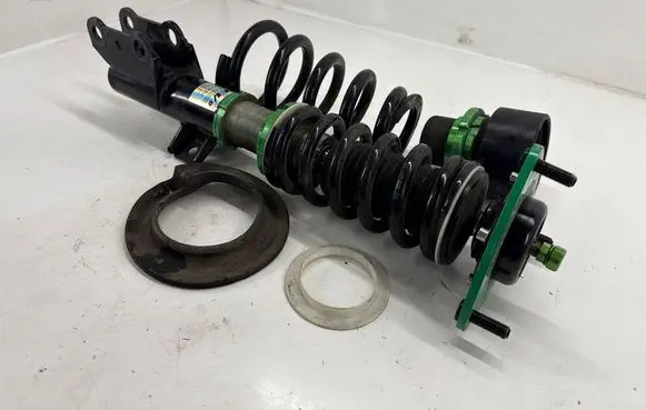 Ford Mustang VI Front shock absorber with coil spring R9HPX1210