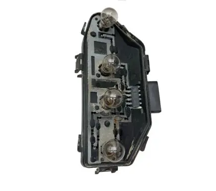 Tail light bulb cover holder