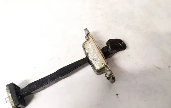 Front door check strap stopper