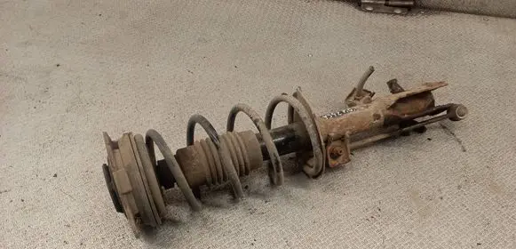 Nissan Tiida C11 Front shock absorber with coil spring 