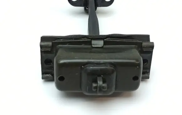 Front door check strap stopper