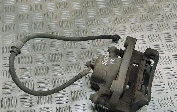 Nissan Juke I F15 Front brake caliper