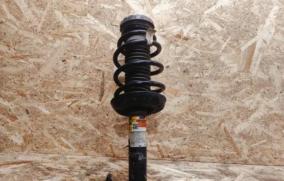 Cadillac XTS Front shock absorber with coil spring 22296966