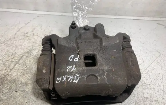 Nissan Juke I F15 Front brake caliper