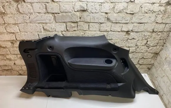 Trunk/boot lower side trim panel