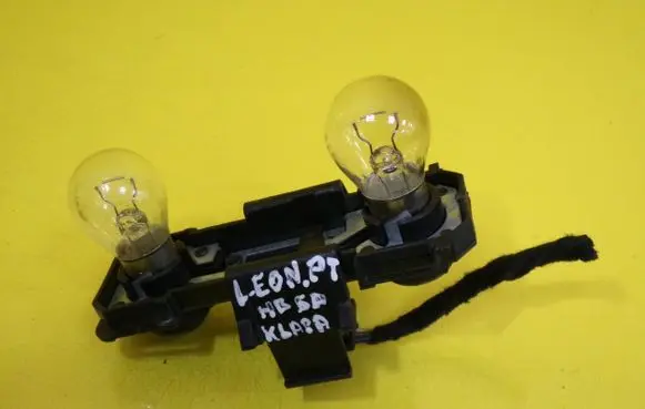 Tail light bulb cover holder