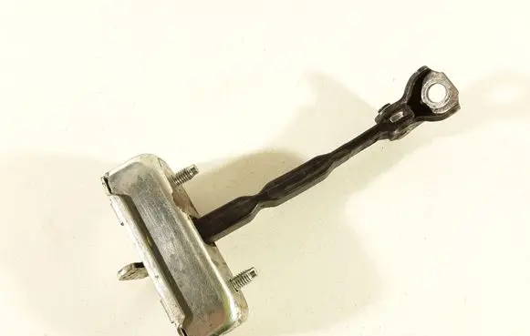 Front door check strap stopper