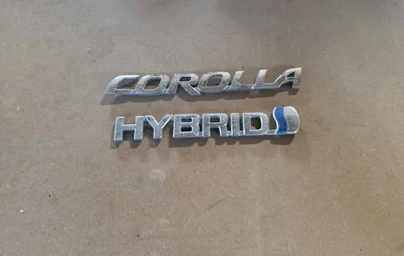 Toyota Corolla E210 E21 Manufacturers badge/model letters 