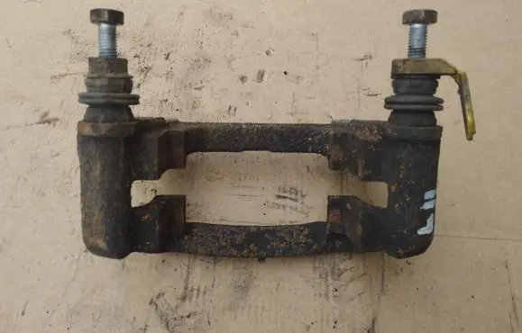 Renault Trafic III (X82) Brake caliper pad carrier rear 323277507