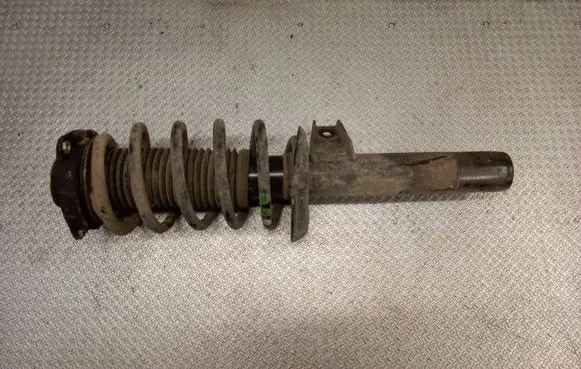 Volkswagen Caddy Front shock absorber with coil spring
