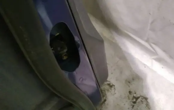 Front door check strap stopper