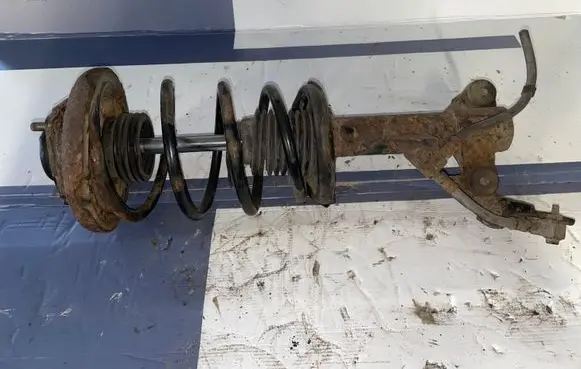 Nissan Primera Front shock absorber with coil spring
