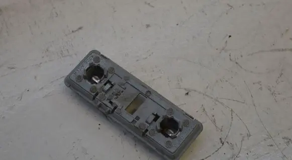 Saab 9-5 Tail light bulb cover holder