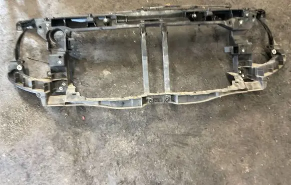 Radiator support slam panel