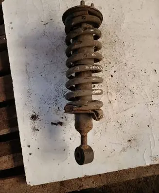 Nissan Pathfinder R51 Front shock absorber with coil spring