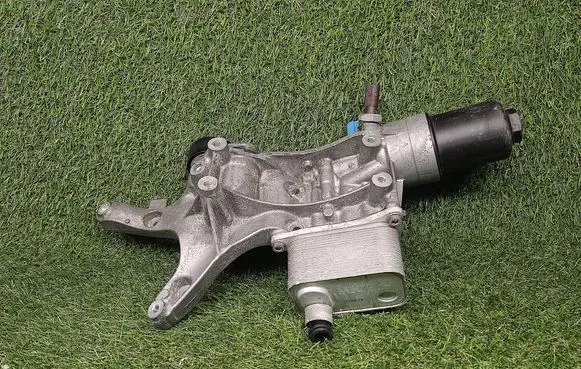 Volkswagen Jetta VI Oil filter mounting bracket 06K117021B