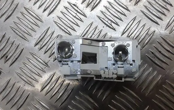 Tail light bulb cover holder