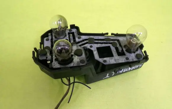 Tail light bulb cover holder