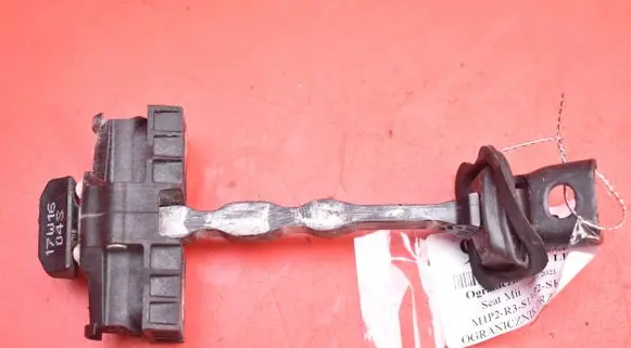Front door check strap stopper