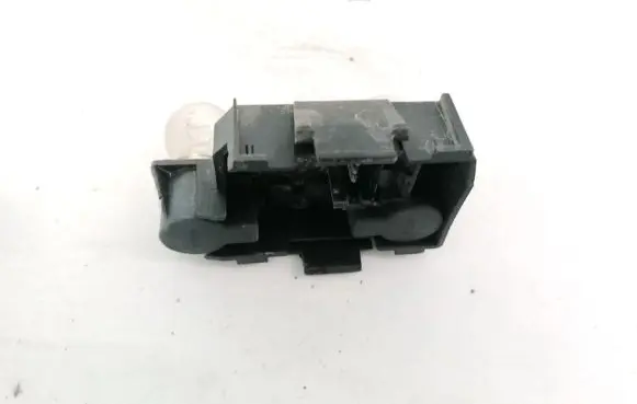 Tail light bulb cover holder