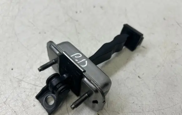 Front door check strap stopper