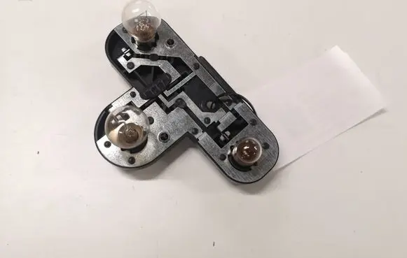 Tail light bulb cover holder