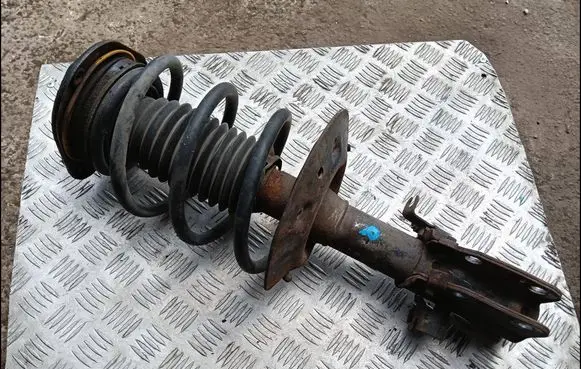 Cadillac DeVille Front shock absorber with coil spring