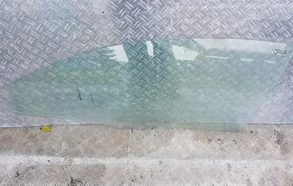 Mazda 323 Front door window glass four-door