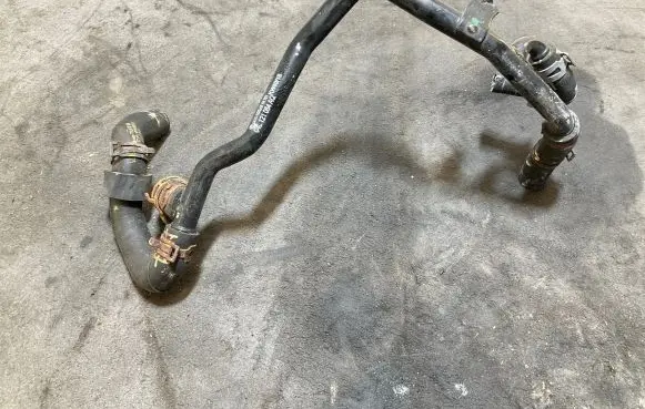 Volkswagen Golf VII Engine coolant pipe/hose 04L121064AQ