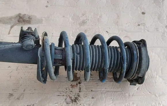 Volkswagen Caddy Front shock absorber with coil spring
