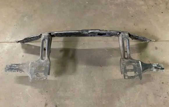 Top upper radiator support slam panel