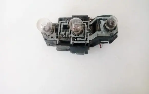 Tail light bulb cover holder