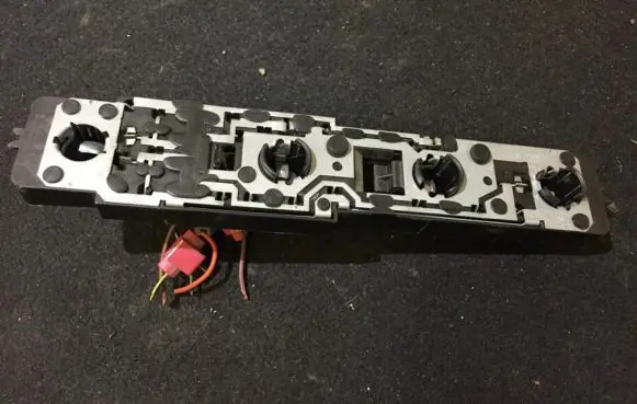 Tail light bulb cover holder
