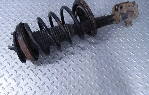 Front shock absorber with coil spring