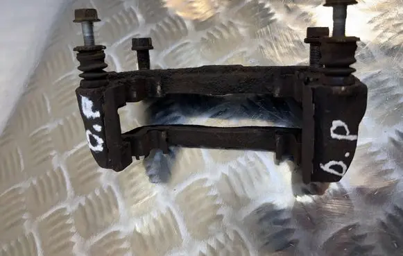 Subaru Legacy Front Brake Caliper Pad/Carrier 