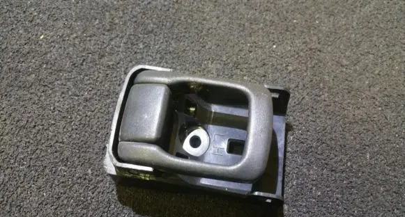 Mazda 323 Front door interior handle
