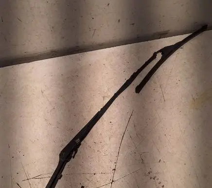 Front wiper blade arm