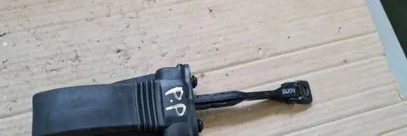 Front door check strap stopper