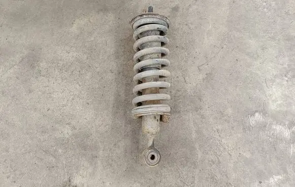Nissan Navara D40 Front shock absorber with coil spring