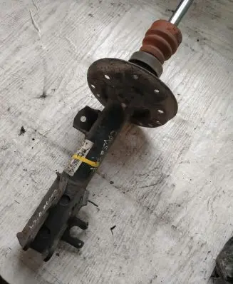 Opel Corsa D Front shock absorber with coil spring 13214354