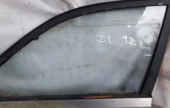 Mazda 121 Front door window glass four-door
