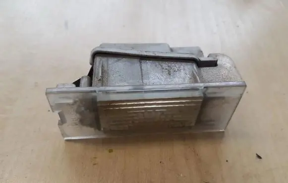 Renault Laguna II Number plate light 7700796163
