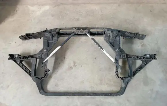 Radiator support slam panel