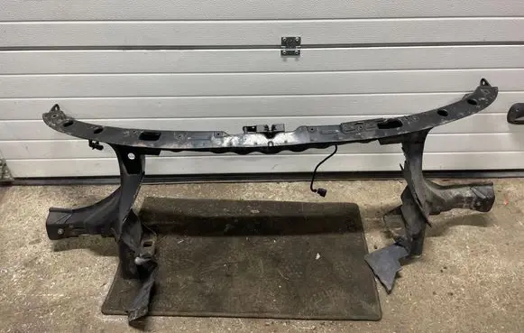 Radiator support slam panel