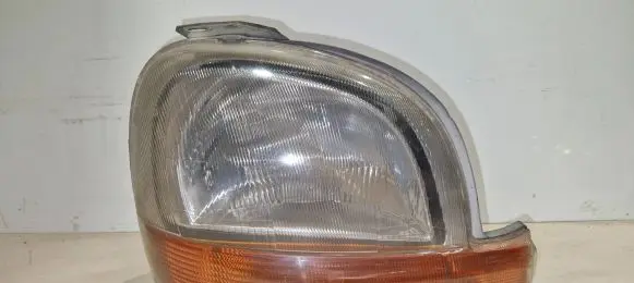 Renault Kangoo I Headlight/headlamp 7701044037