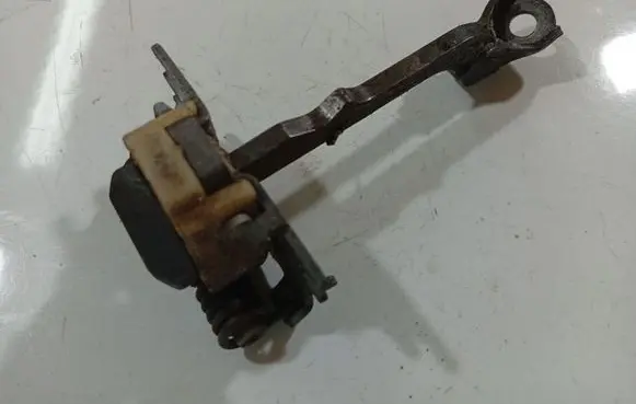 Rear door check strap stopper